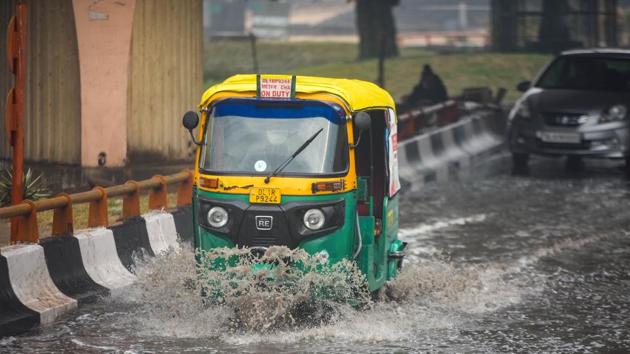 Vehicles crossing a waterlogged stretch after morning rains near AIIMS Hospital in New Delhi on Sunday. (Amal KS/HT PHOTO) Vehicles crossing a waterlogged stretch after morning rains near AIIMS Hospital in New Delhi on Sunday. (Amal KS/HT PHOTO)