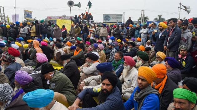 Farmers during their protest against the new farm laws at Singhu border in New Delhi.(PTI)