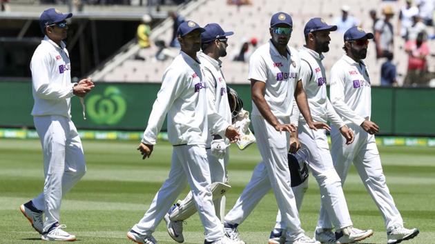 Indian players walk from the field after dismissing Australia for 200 runs in their second innings during play on day four of the second cricket test between India and Australia at the Melbourne Cricket Ground.(AP)