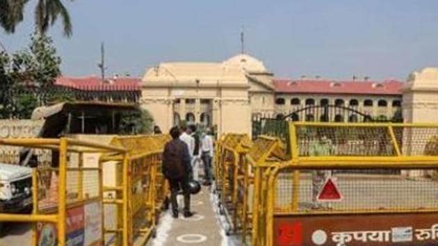 File photo: People undergo thermal screening outside Allahabad High Court.(PTI)