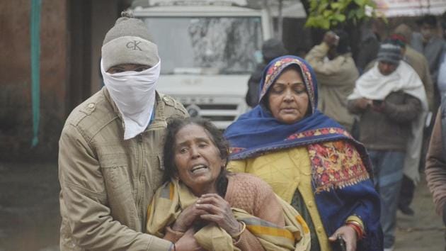 The relatives of a person injured in the collapse of a roof at a crematorium in Muradnagar, seen at MMG district hospital in Ghaziabad, India.(Photo by Sakib Ali /Hindustan Times)