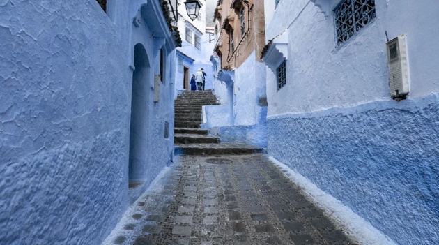The picturesque town, its facades painted in distinctive hues of blue, shut its small population off from the world, and kept the virus out for months.(Unsplash) The picturesque town, its facades painted in distinctive hues of blue, shut its small population off from the world, and kept the virus out for months.(Unsplash)