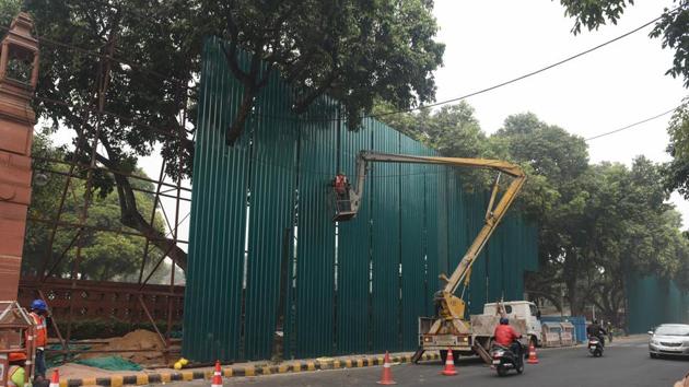 The perimeter of a construction site, part of the Central Vista project, is blocked by large metal sheets, at Rafi Marg in New Delhi, India, on Wednesday.(Vipin Kumar/HT PHOTO)