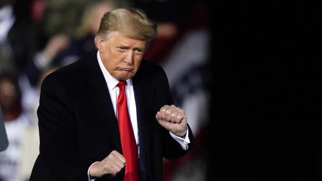President Donald Trump dances after speaking at a campaign rally in support of Senate candidates Sen. Kelly Loeffler, R-Ga., and David Perdue in Dalton, Ga., on Monday.(AP File Photo) President Donald Trump dances after speaking at a campaign rally in support of Senate candidates Sen. Kelly Loeffler, R-Ga., and David Perdue in Dalton, Ga., on Monday.(AP File Photo)