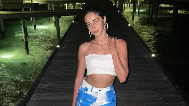 Ananya Panday shows us how to rock tie-dye denims while holidaying on the beach. Ananya Panday shows us how to rock tie-dye denims while holidaying on the beach.