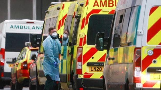 A medic stands next to an ambulance at the Royal London Hospital, amid the coronavirus disease (Covid-19) outbreak, in London, Britain.(REUTERS) A medic stands next to an ambulance at the Royal London Hospital, amid the coronavirus disease (Covid-19) outbreak, in London, Britain.(REUTERS)