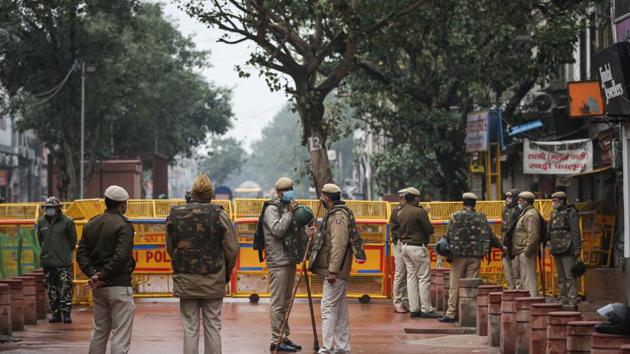 Delhi Police personnel stand guard during a protest by members of Vishwa Hindu Parishad (VHP) and Bajrang Dal over the demolition of a Hanuman temple, at Chandni Chowk, in New Delhi. (Sanchit Khanna/HT Photo) Delhi Police personnel stand guard during a protest by members of Vishwa Hindu Parishad (VHP) and Bajrang Dal over the demolition of a Hanuman temple, at Chandni Chowk, in New Delhi. (Sanchit Khanna/HT Photo)