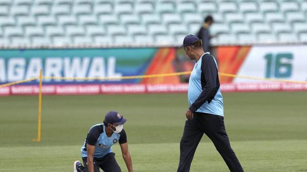 Sydney:India's Ajinkya Rahane, left, and head coach Ravi Shastri check the wicket before training at the Sydney Cricket Ground in Sydney, Wednesday, Jan. 6, 2021, ahead of their cricket test against Australia starting Thursday.AP/PTI Photo(AP01_06_2021_000033A) (AP) Sydney:India's Ajinkya Rahane, left, and head coach Ravi Shastri check the wicket before training at the Sydney Cricket Ground in Sydney, Wednesday, Jan. 6, 2021, ahead of their cricket test against Australia starting Thursday.AP/PTI Photo(AP01_06_2021_000033A) (AP)