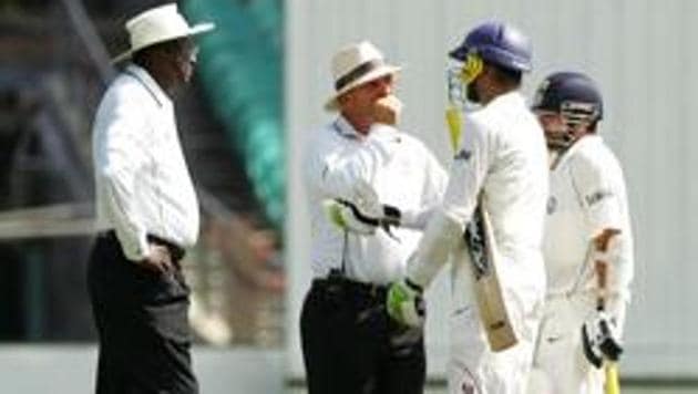 Umpires Steve Bucknor (L) and Mark Benson talk with Harbhajan Singh and Sachin Tendulkar (R) of India during day three of the Second Test match between Australia and India at the Sydney Cricket Ground on January 4, 2008 in Sydney, Australia.(Getty Images)