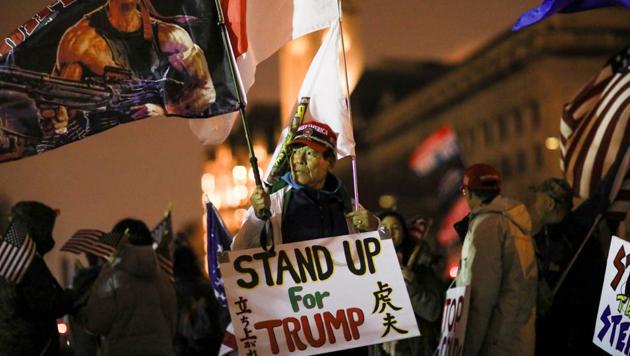 A supporter of US President Donald Trump holds a sign during a rally ahead of the US Congress certification of the November 2020 election results during protests in Washington, US on January 5, 2021.(Reuters File Photo)