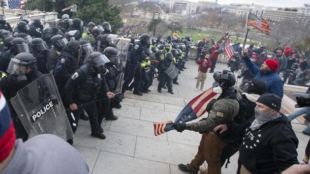 Police push back demonstrators trying to enter the US Capitol on Wednesday, in Washington.(AP Photo)