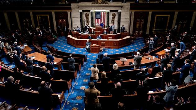 The House of Representatives reconvenes to continue the process of certifying the 2020 Electoral College results on January 6. Hours after the mob stormed Capitol in a harrowing assault on American democracy, a shaken Congress formally certified Democrat Joe Biden’s election victory. (Erin Schaff / Pool via REUTERS) The House of Representatives reconvenes to continue the process of certifying the 2020 Electoral College results on January 6. Hours after the mob stormed Capitol in a harrowing assault on American democracy, a shaken Congress formally certified Democrat Joe Biden’s election victory. (Erin Schaff / Pool via REUTERS)