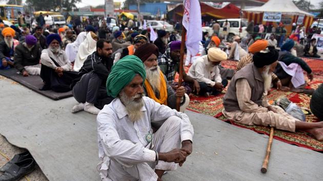 An old farmer sitting during an ongoing protest against the new farm laws, at the Singhu border in New Delhi on Thursday. (ANI Photo)(ANI)