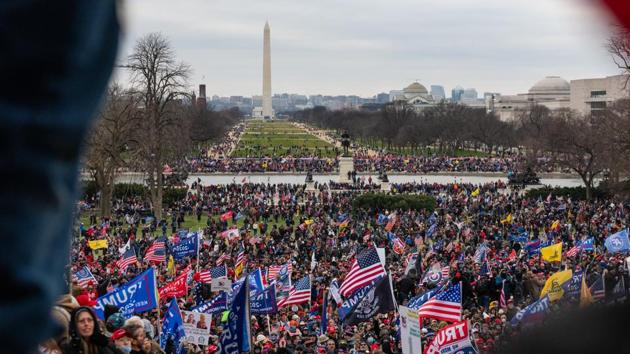 Demonstrators attempt to enter the US Capitol building during a protest in Washington, D.C on January 6. The US Capitol was placed under lockdown and Vice President Mike Pence left the floor of Congress as hundreds of Demonstrators swarmed past barricades surrounding the building where lawmakers were debating Joe Biden's victory in the Electoral College. (Eric Lee / Bloomberg) Demonstrators attempt to enter the US Capitol building during a protest in Washington, D.C on January 6. The US Capitol was placed under lockdown and Vice President Mike Pence left the floor of Congress as hundreds of Demonstrators swarmed past barricades surrounding the building where lawmakers were debating Joe Biden's victory in the Electoral College. (Eric Lee / Bloomberg)