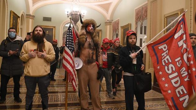 Supporters of US President Donald Trump in the US Capitol on January 6. The mob’s storming of Congress prompted outrage, mostly from Democrats but from Republicans as well, as lawmakers accused Trump of fomenting the violence with falsehoods about election fraud. (Saul Loeb / AFP) Supporters of US President Donald Trump in the US Capitol on January 6. The mob’s storming of Congress prompted outrage, mostly from Democrats but from Republicans as well, as lawmakers accused Trump of fomenting the violence with falsehoods about election fraud. (Saul Loeb / AFP)