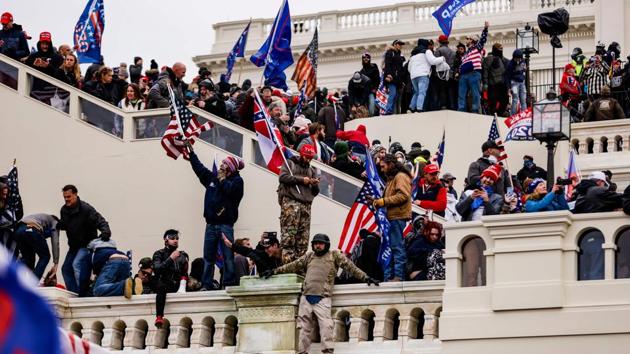 Pro-Trump supporters storm the US Capitol following a rally with President Donald Trump on January 6, 2021 in Washington, DC.(AFP)
