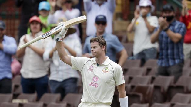 Australia's Steve Smith waves to the crowd as he walks from the field after he was run out 131 runs during play on day two of the third cricket test between India and Australia at the Sydney Cricket Ground, Sydney, Australia, Friday, Jan. 8, 2021. (AP Photo/Rick Rycroft)(AP)