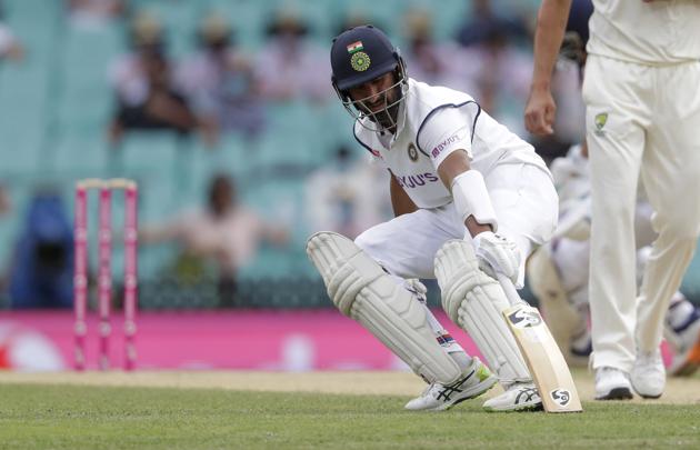 India's Cheteshwar Pujara runs a single during play on day two of the third cricket test between India and Australia at the Sydney Cricket Ground, Sydney, Australia, Friday, Jan. 8, 2021. (AP Photo/Rick Rycroft) (AP)