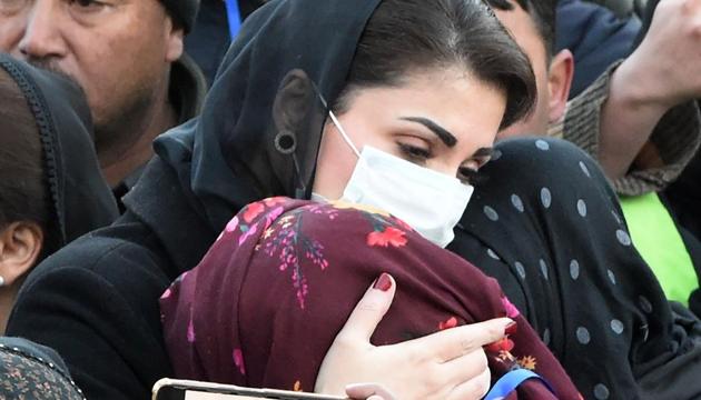 Maryam Nawaz (left), opposition leader and daughter of former prime minister Nawaz Sharif, meets with mourners from the Shia Hazara community gathering near the coffins of miners, who were killed in an attack by gunmen in the mountainous Machh area, during a sit-in protest at the eastern bypass on the outskirts of Quetta on January 7.(AFP)