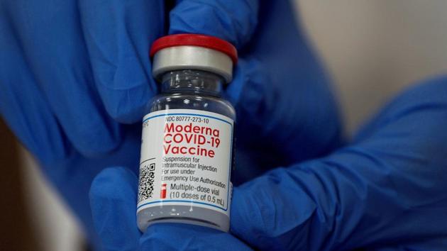 An employee shows the Moderna coronavirus disease vaccine at Northwell Health's Long Island Jewish Valley Stream hospital in New York on December 21, 2020.(Reuters file) An employee shows the Moderna coronavirus disease vaccine at Northwell Health's Long Island Jewish Valley Stream hospital in New York on December 21, 2020.(Reuters file)