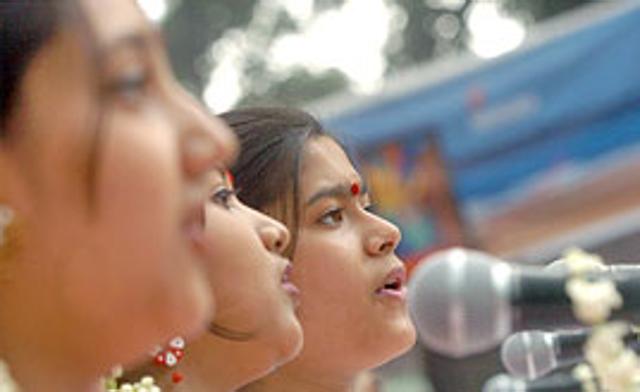 Bangladeshi performers from a music school sing songs on the occasion of Pohela Baishakh, the first day of the Bengali New Year at Ramna Batomul in Dhaka on Satuurday, April 14, 2007.