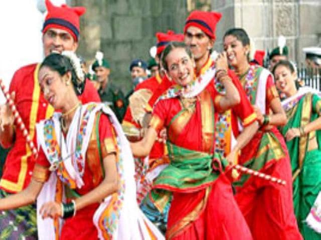 Dancers perform the Koli at the Gateway of India in Mumbai as "Bravo" the Bison, the official mascot for the 4th Military World Games is unveiled.