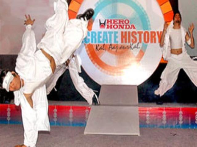 Artists perform at the launch function of Hero Honda's new offering Splendor NXG in New Delhi.