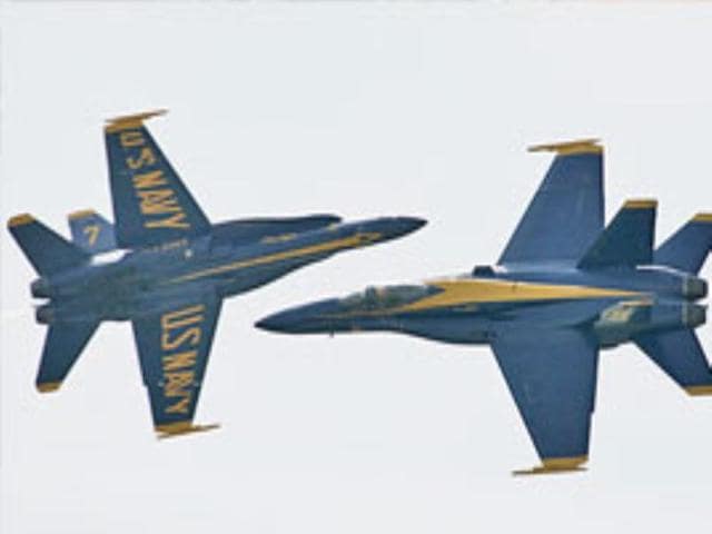 A US Navy Blue Angels flight demonstration team fly the F/A-18 Hornet aircraft.