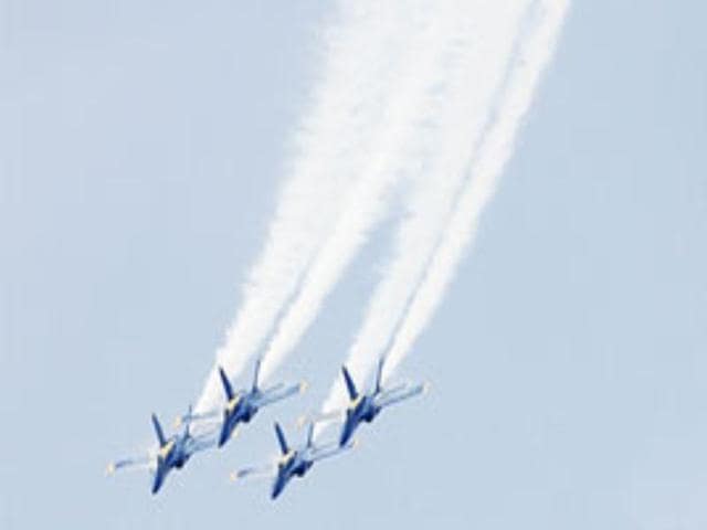 Members of the US Navy Blue Angels flight demonstration team perform at an air show in Oklahoma.