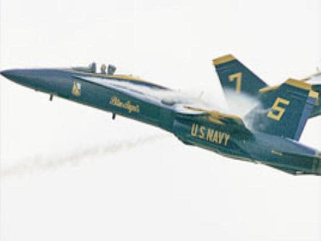Two members of the US Navy Blue Angels flight demonstration team fly the F/A-18 Hornet aircraft during the Star Spangled Salute air show at Tinker Air Force Base near Oklahoma.