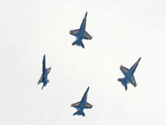 Members of the US Navy Blue Angels flight demonstration team perform at the Star Spangled Salute air show at Tinker Air Force Base, near Oklahoma.
