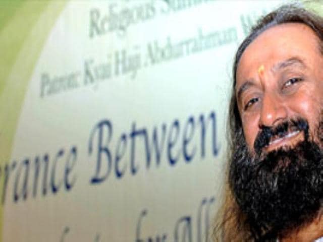 Sri Sri Ravi Shankar smiles as he arrives at a conference meant to promote religious tolerance in Bali, Indonesia on June 12, 2007.