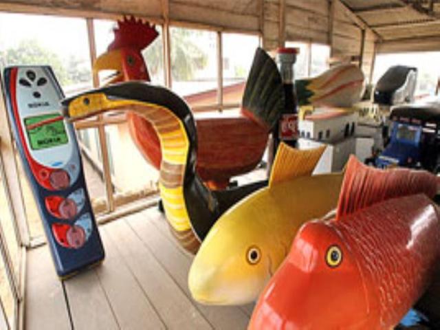 Accra shows coffins in the form of animals and portable telephone.