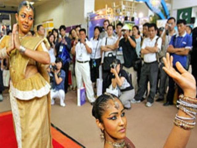 Dancers from Sri Lanka perform for the crowd on the opening day of the Beijing International Tourism Expo.