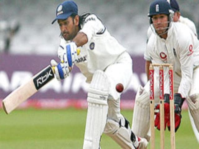 MS Dhoni sweeps a delivery off Michael Vaughan.