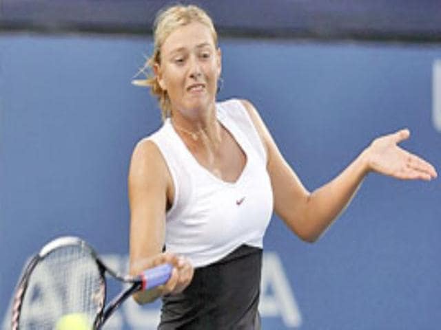 Maria Sharapova hits a forehand shot.
