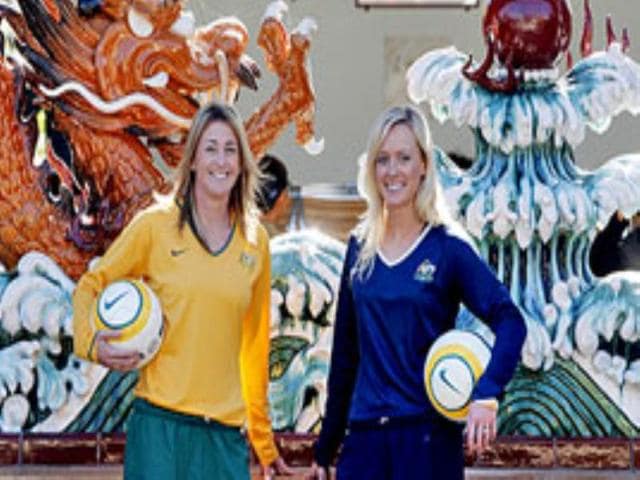 Australian women soccer team players pose for a photo at the Chinese Gardens in Sydney.