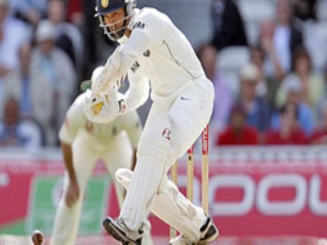 India's Dinesh Karthik hits a ball off England's Ryan Sidebottom.