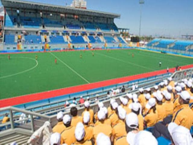 Fans watch a hockey match between South Africa and China at the Olympic Green stadium in Beijing. Fans watch a hockey match between South Africa and China at the Olympic Green stadium in Beijing.