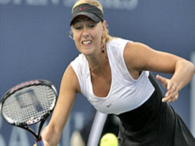 Maria Sharapova of Russia returns a shot to Eleni Daniilidou of Greece. Maria Sharapova of Russia returns a shot to Eleni Daniilidou of Greece.