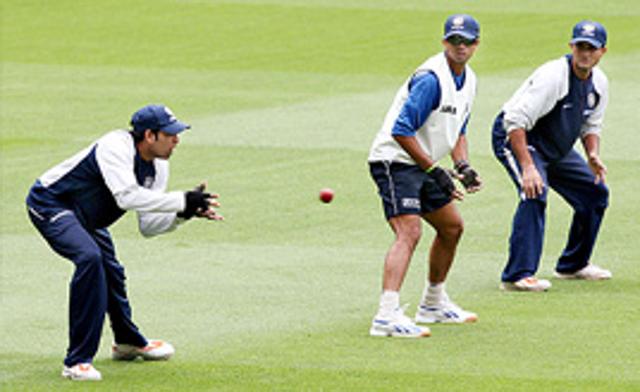 V.V.S Laxman prepares to take a slips catch as teammates Sachin Tendulkar, Rahul Dravid and Sourav Ganguly looks on during training at the MCG in Melbourne.
