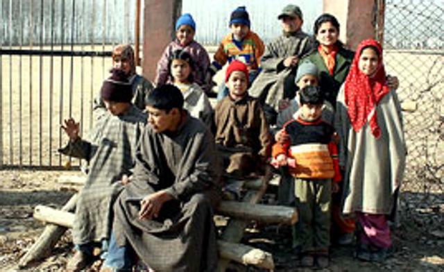 Shaist, Faisal and some other kids outside the Sopore playfield.