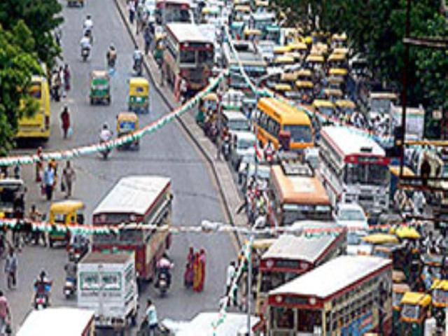 Vehicles gets stuck in a serpentine traffic jam after supporters of Congress party block a road in Ahmedabad