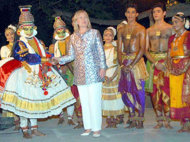 US Secretary of State Hillary Clinton shakes hands with an artist after enjoying cultural dance programme at Kalakshetra in Chennai.