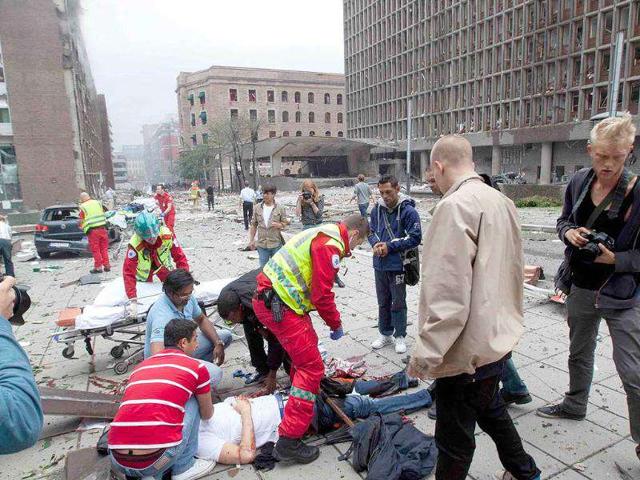 People are treated at the scene after an explosion in Oslo, Norway.
