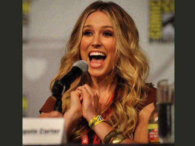 Sarah Sanguin Carter, an actress in the TNT drama series, Falling Skies, talks during a screening and panel discussion on the second day of Comic-Con 2011 in San Diego, California.