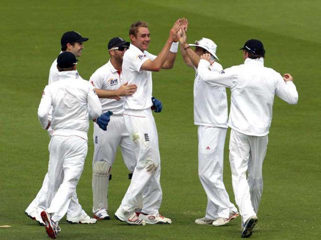 England's Stuart Broad (C) celebrates taking the first Indian wicket of Gautum Gambhir for 15 runs during Day three of the first Test match at Lord's Cricket Ground in London.