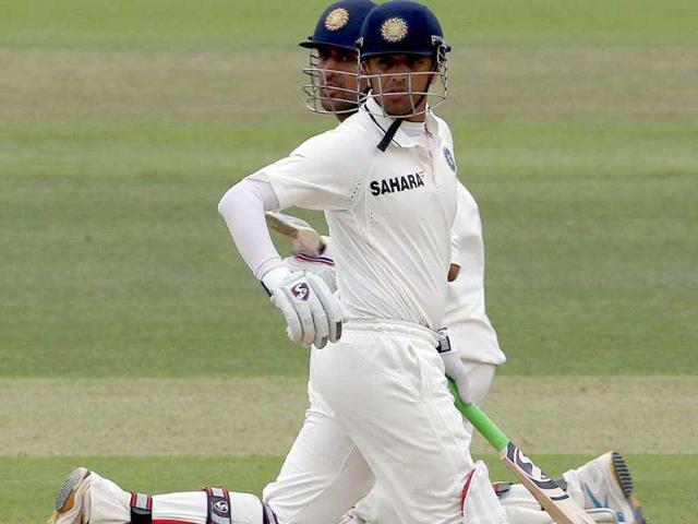 Rahul-Dravid-front-and-MS-Dhoni-back-run-down-the-wicket-past-each-other-against-England-during-Day-three-of-the-1st-Test-match-at-Lord-s-Cricket-Ground-in-London