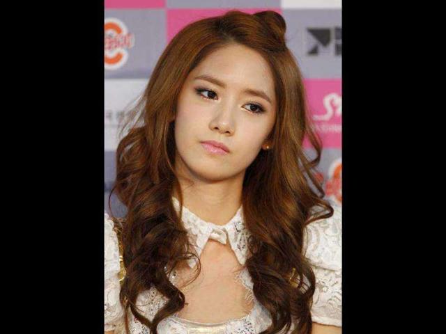 Yoona, a member of South Korean pop group Girls' Generation, attends a news conference before their concert at Olympic Gymnasium in Seoul.