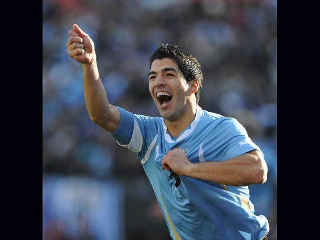 Uruguay-s-Luis-Suarez-celebrates-with-teammates-after-scoring-his-team-s-first-goal-during-their-World-Cup-Group-D-match-against-England-at-the-Corinthians-arena-in-Sao-Paulo-Reuters-Photo